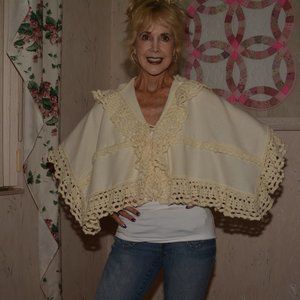 Creamy wool pponcho with hand crochet edge